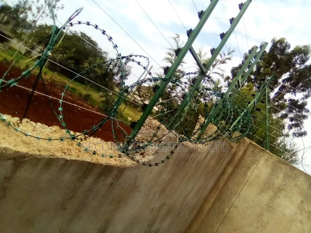 Wall Mount Electric Fencing With Green Razor Wire