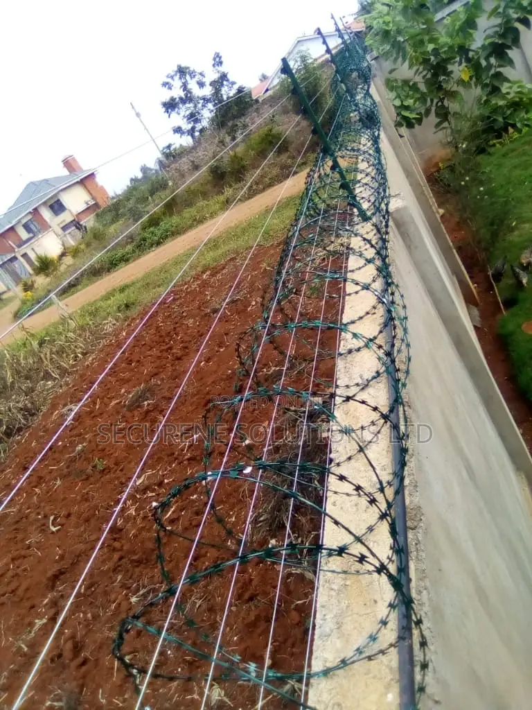 Wall Mount Electric Fencing With Green Razor Wire