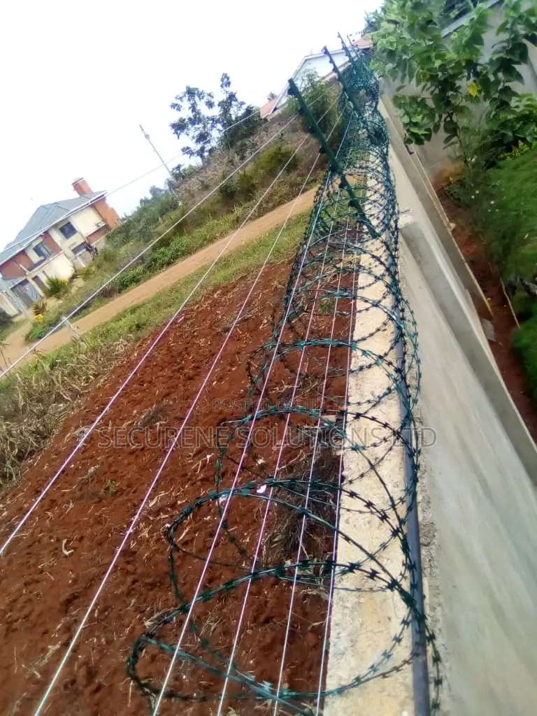 Wall Mount Electric Fencing With Green Razor Wire