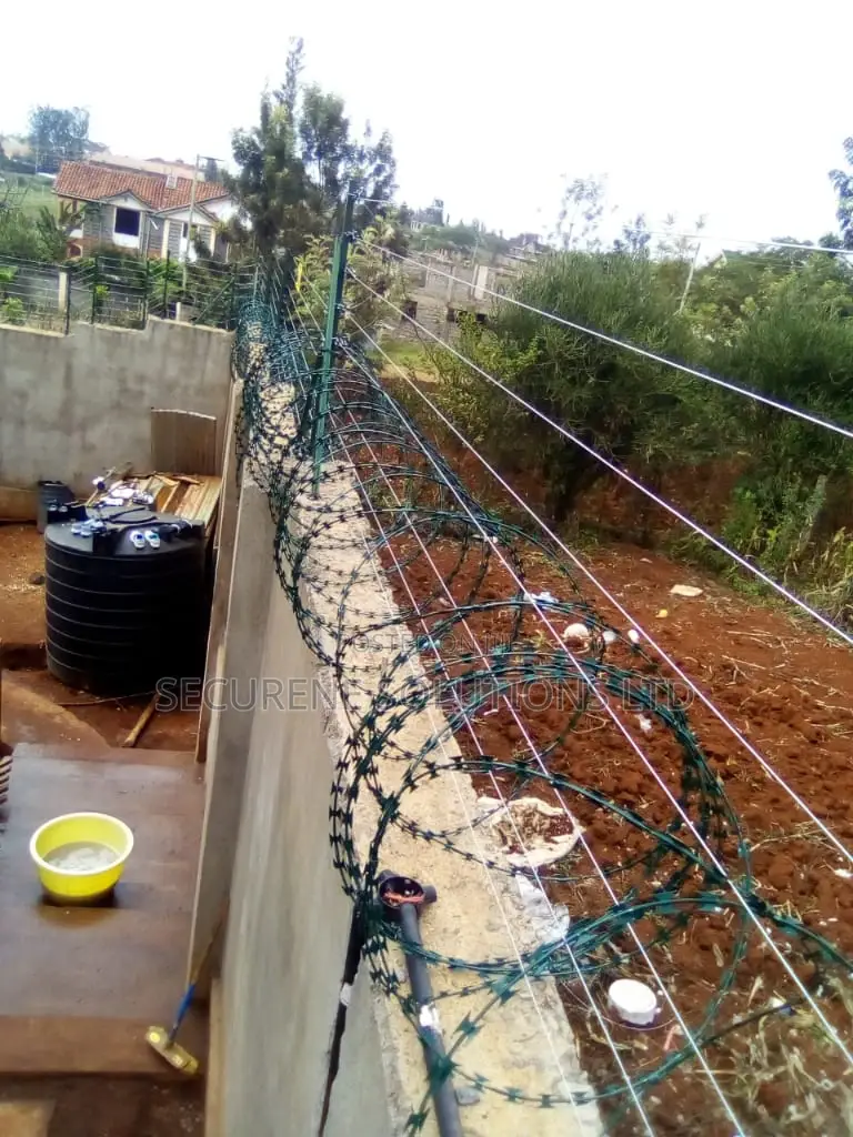 Wall Mount Electric Fencing With Green Razor Wire
