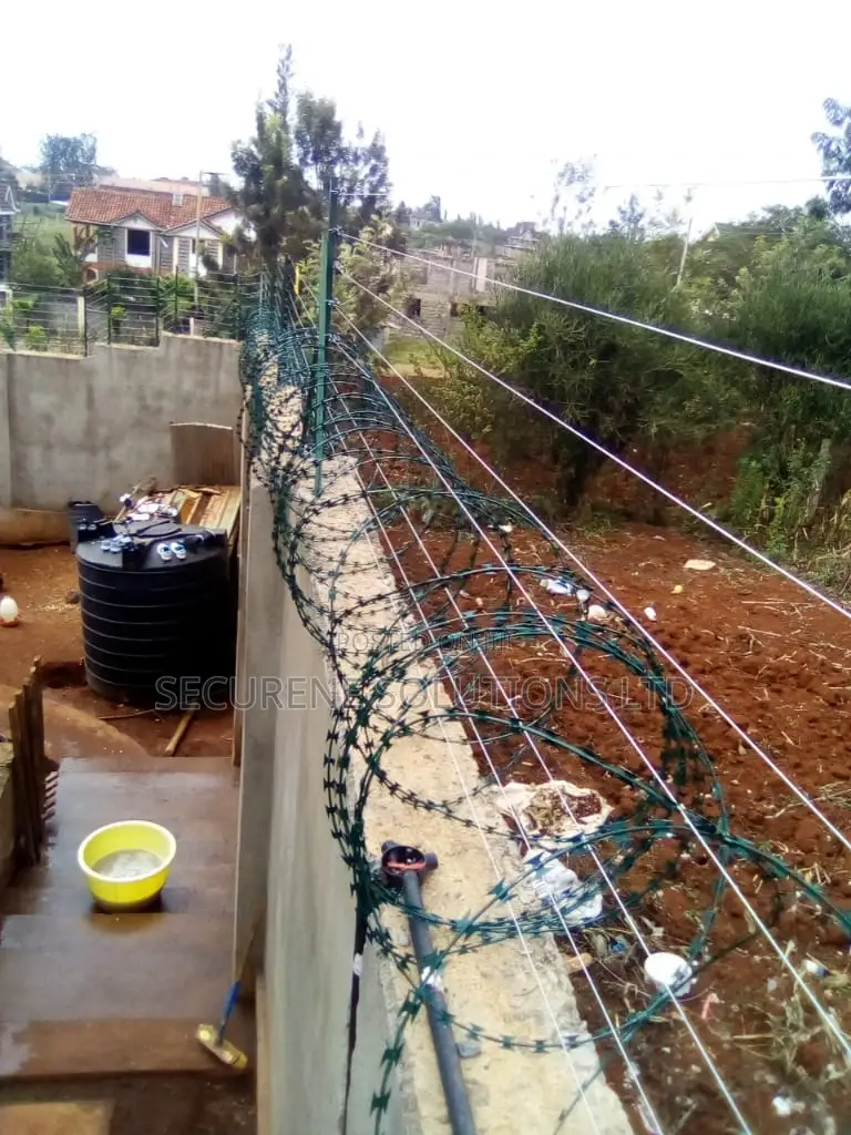 Wall Mount Electric Fencing With Green Razor Wire