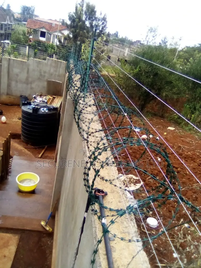 Wall Mount Electric Fencing With Green Razor Wire