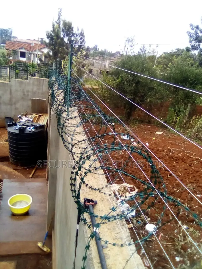 Wall Mount Electric Fencing With Green Razor Wire