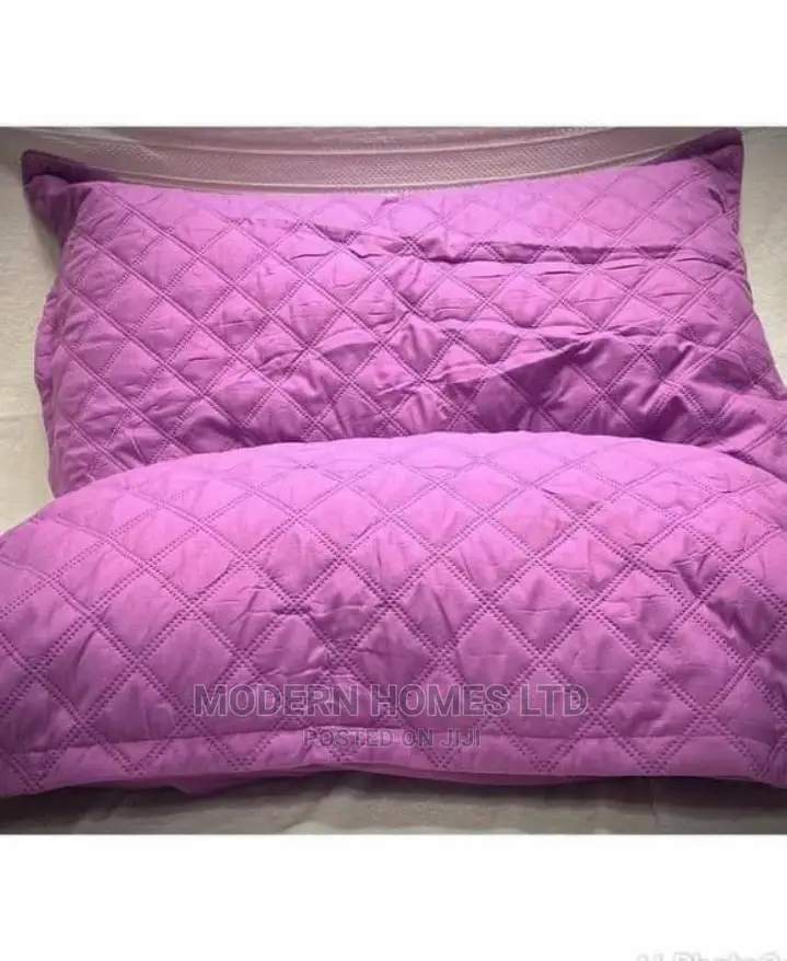 A Pair Of Pillows And Waterproof Pillow Protectors