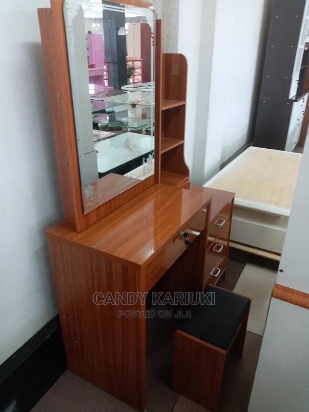 Brown Dresser With Sliding Mirror