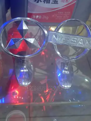 Mitsubishi And Nissan Bonnet Logos