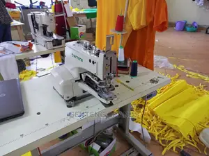Button Attacking Sewing Machine