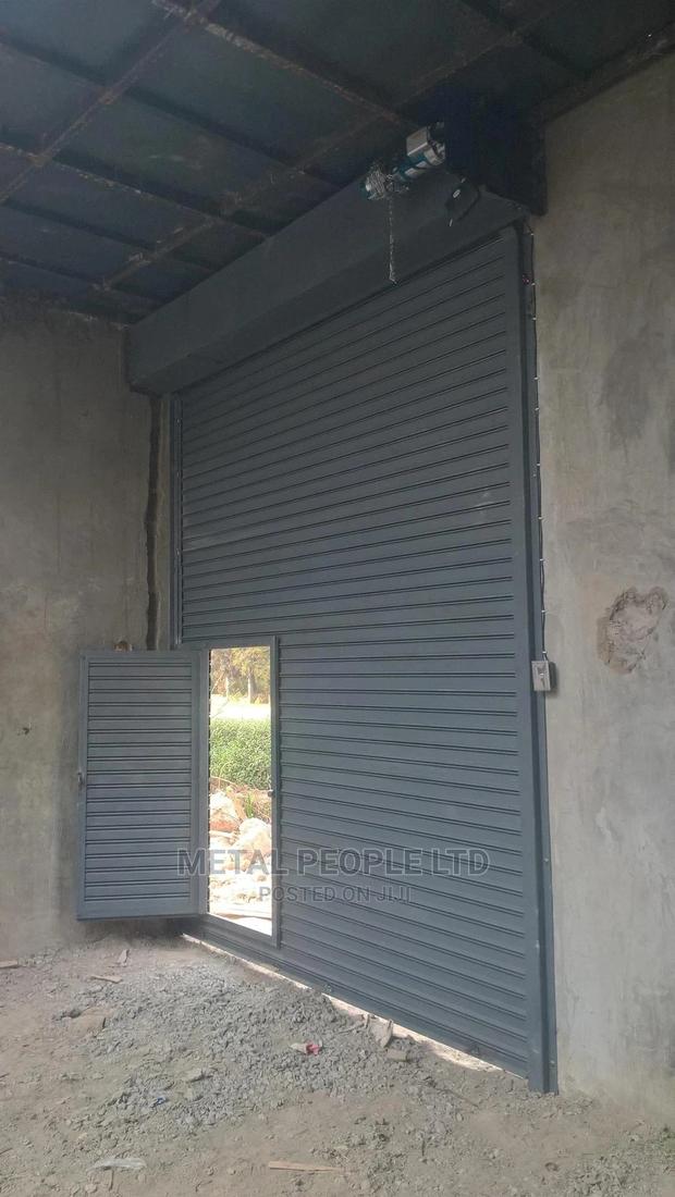 Roller Shutter Doors for Sale. Option of a Small Side Door.