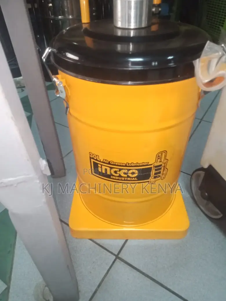 Yellow Greasing Machine