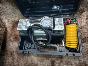 Portable Air Compressor With Puncture Repair Tool