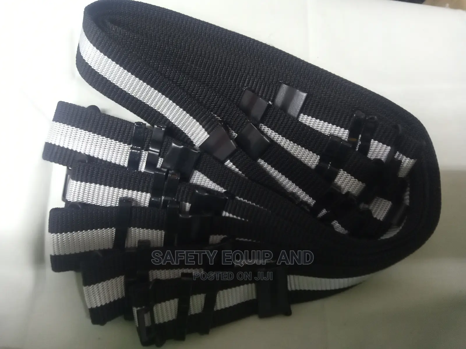 Black Security Belts With a White Strip