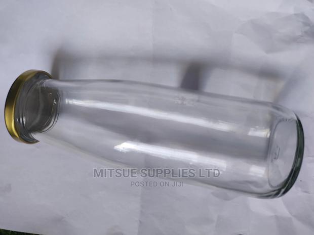 A Box of 50 Camel/Milk/Juice Glass Jars-495/500ml With Lids