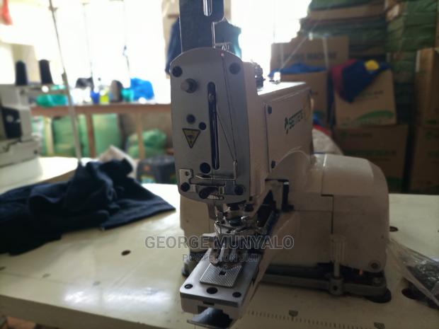 Button Fixing Sewing Machine