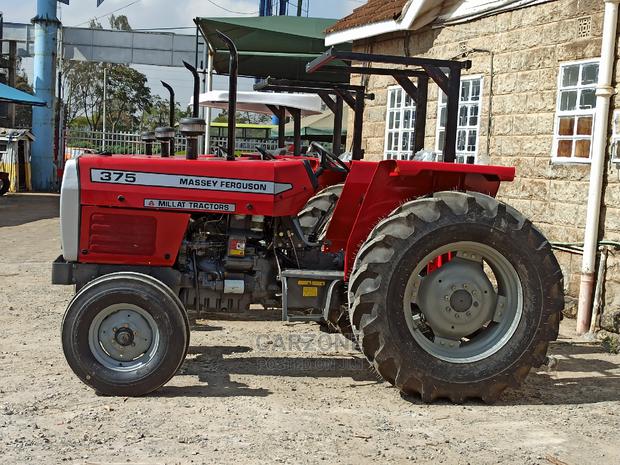 MF 375 Tractor Plus Plow - main view