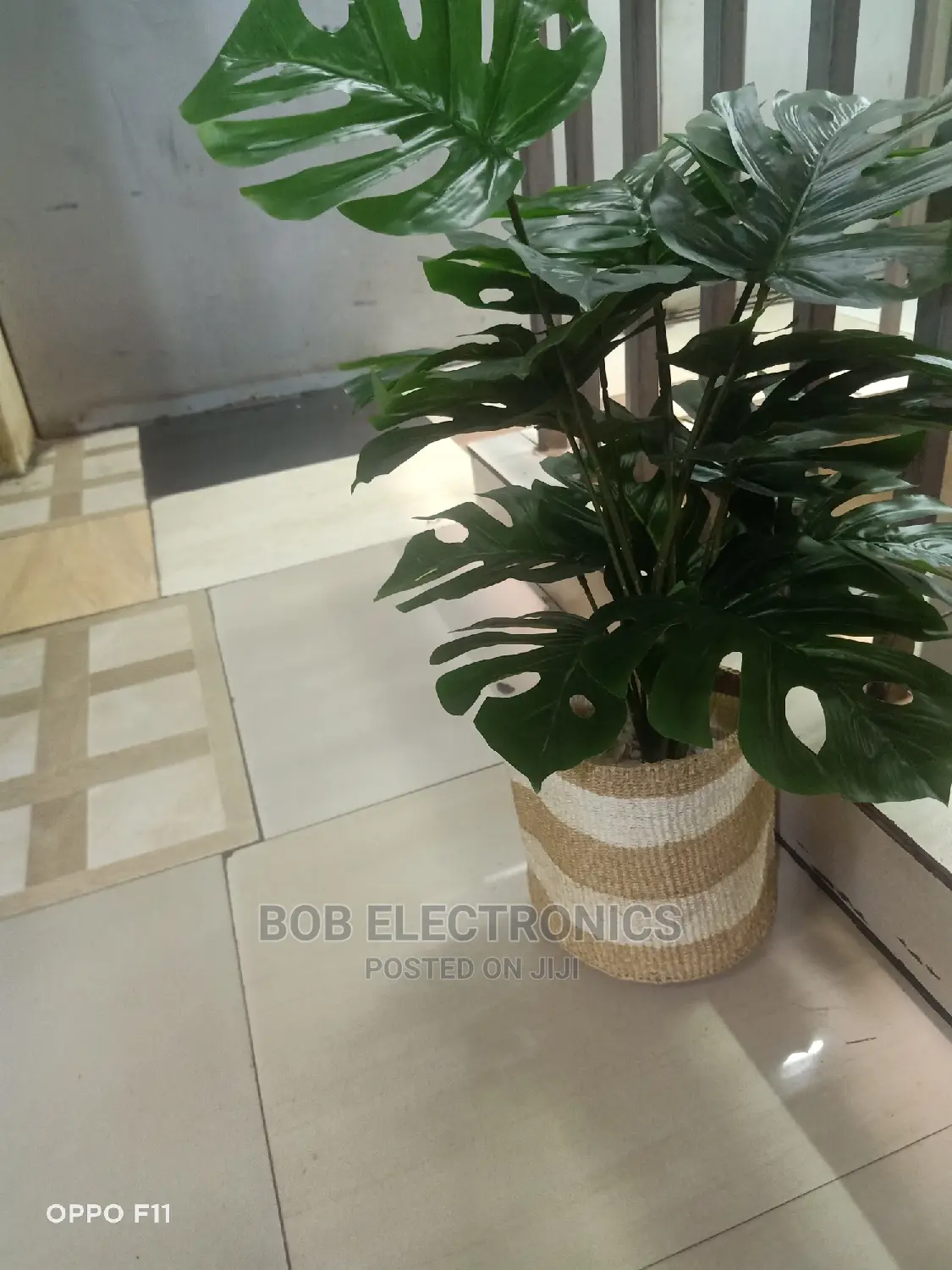 Artificial Monstera Plant With Woven Basket and Pebbles