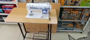 Multi-Purpose Sewing Machine With Table