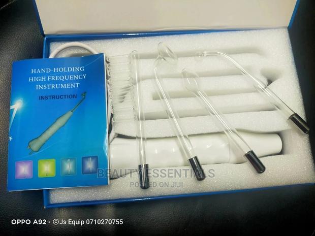 Hand Holding High Frequency Instrument - main view