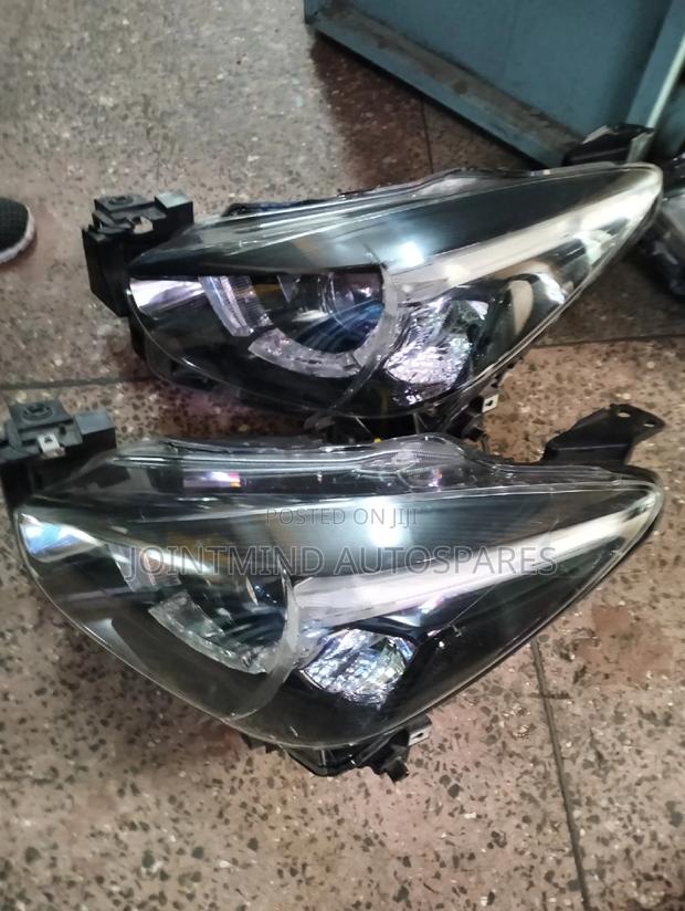 Demio 2014 New Dialled Headlight - main view