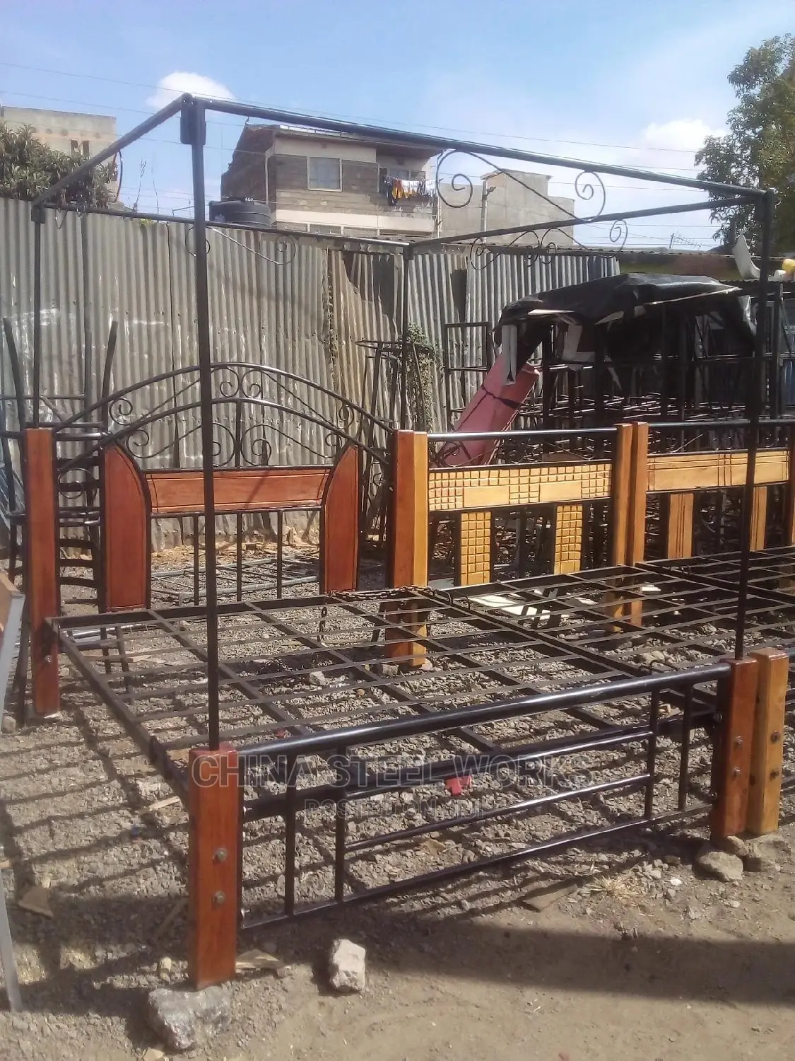 Metalic Frame Mahogany Stand Bed
