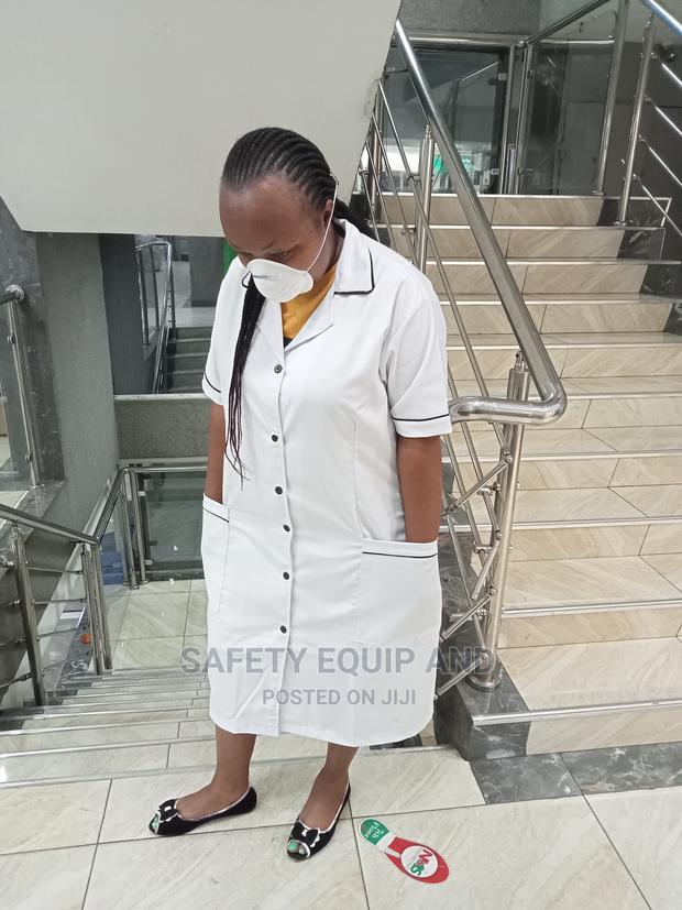 White With Black Piping Medical Dress