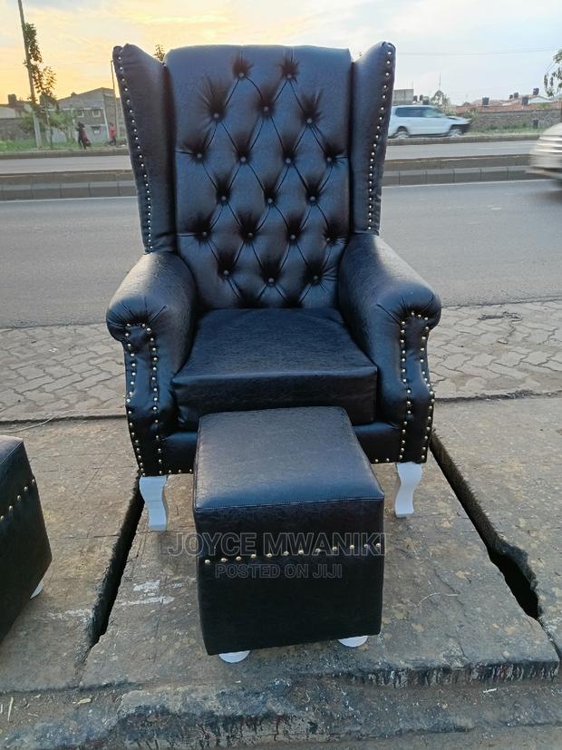 Leather King Chair and a Pouf