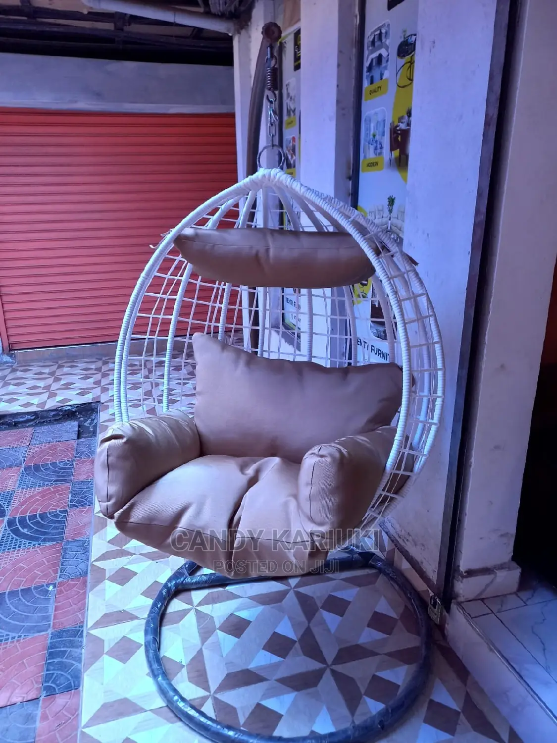Outdoor Swing With Beige Cushions and White Basket