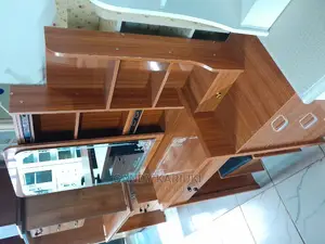 Brown Dresser With a Sliding Mirror