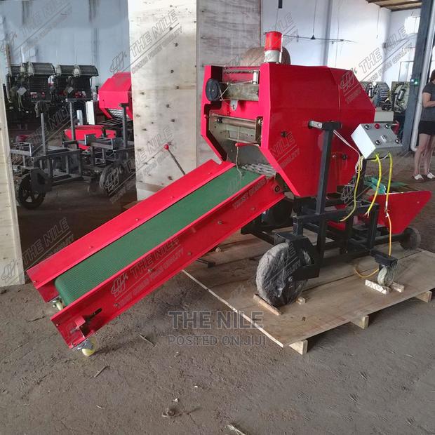Round Bales of Fresh Grass Automatically Coated - main view