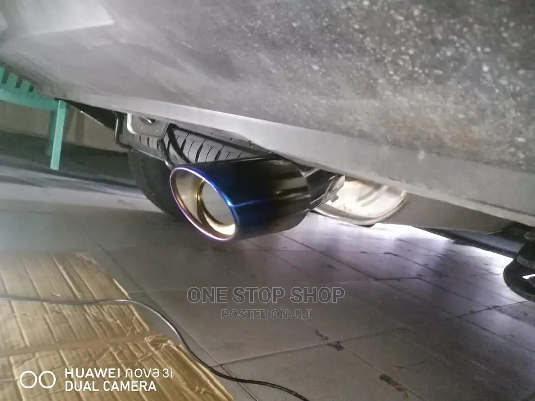Car Fitted With Bent Burnt Blue Universal Exhaust Silver Tip