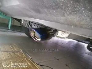 Car Fitted With Bent Burnt Blue Universal Exhaust Silver Tip