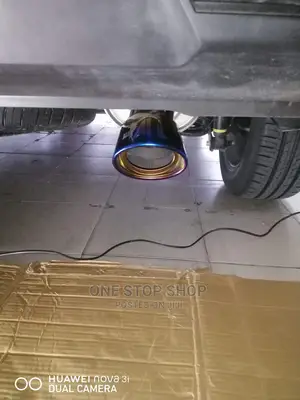 Car Fitted With Bent Burnt Blue Universal Exhaust Silver Tip