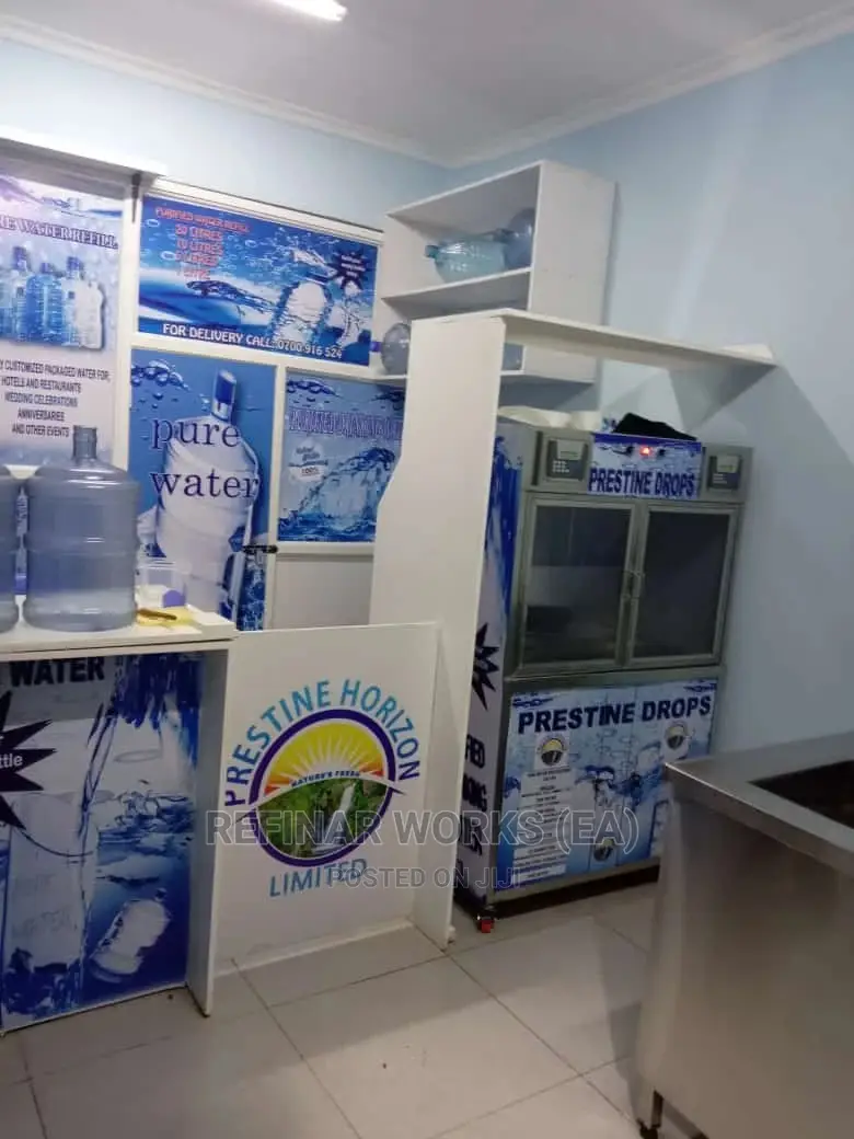 Water Vending Cabinet. Simple Wall Mounted. Accepts Coins.