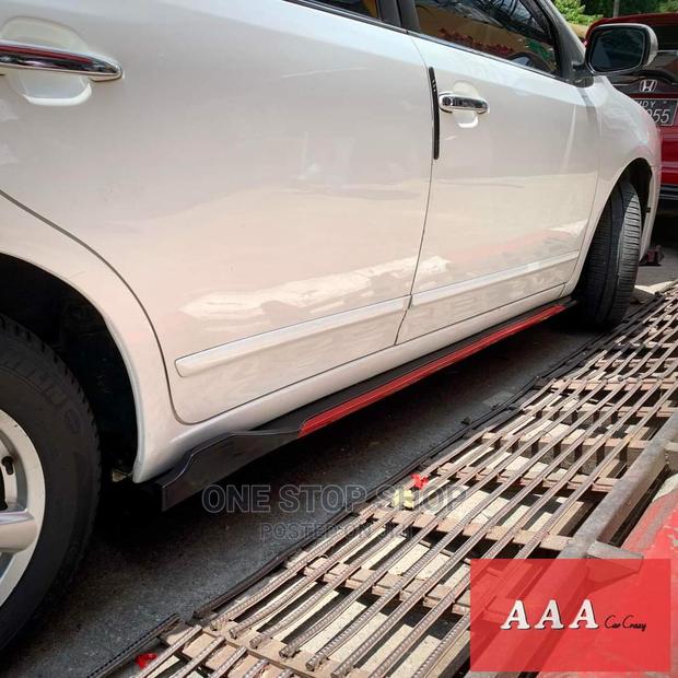 Honda Fit Fitted With Adjustable Bkack Red Side Skirts - main view