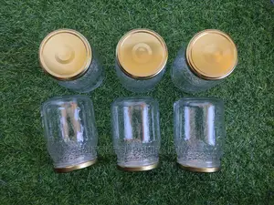 A Box of 24 Mason Jars 740ml With Gold Metal Lids