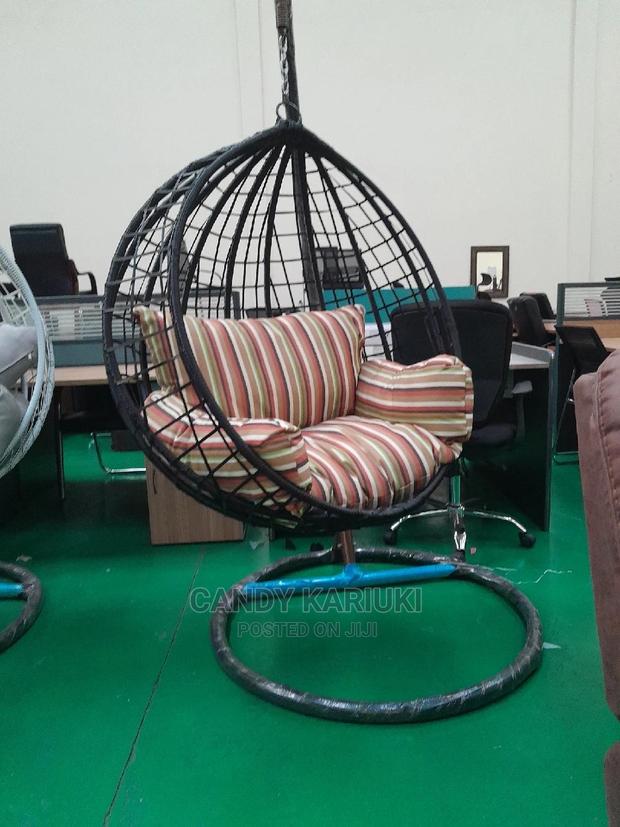 Balcony Swing With Striped Cushions