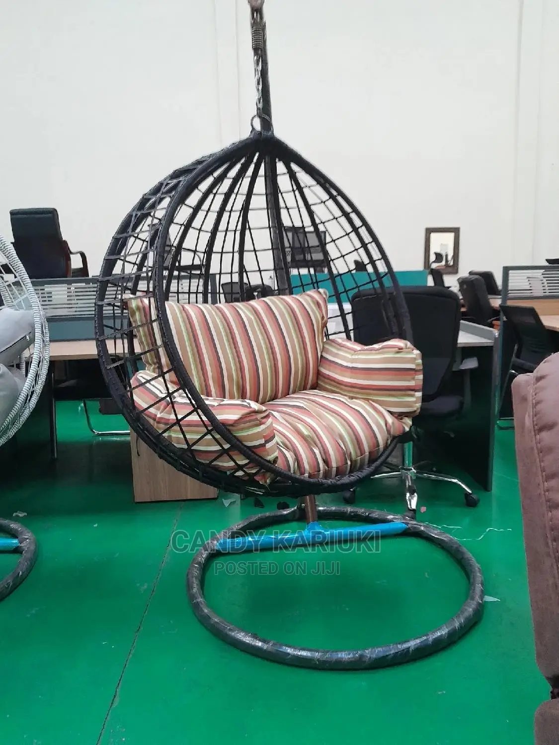 Outdoor Swing With Striped Cushions