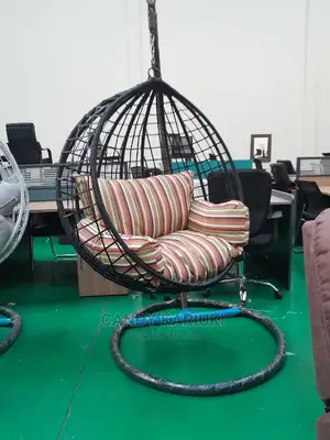 Outdoor Swing With Striped Cushions