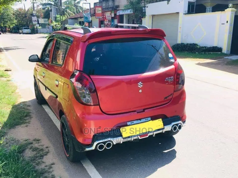 Red Suzuki.Alto Installed With Rear Bumper Silver Diffuser