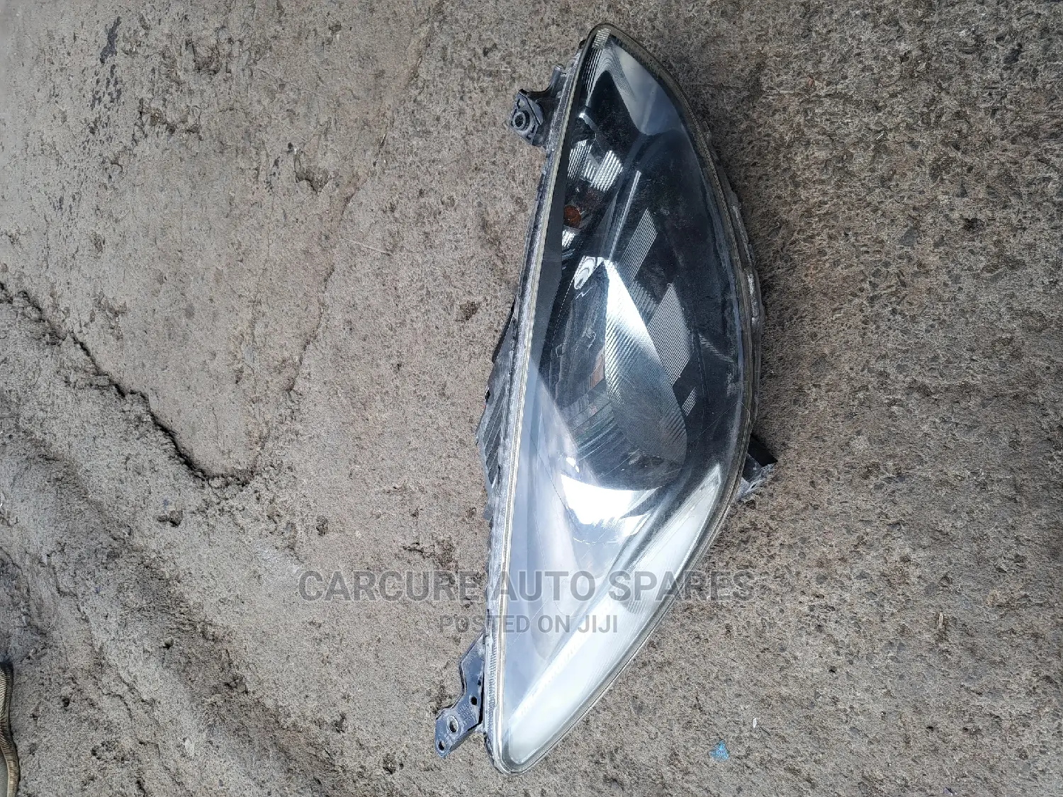 Mazda Demio Headlight