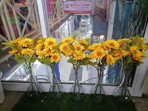 Sunflowers and Glass Vases
