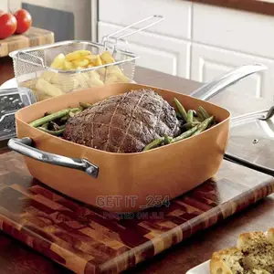 A Copper Pan Has a Temperate Glass Lid
