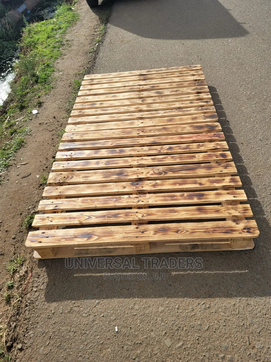 Simple Pallet Bed With Torched Patterns