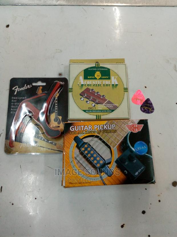 Guitar Pickup With Capo, Strings and 2 Picks - main view