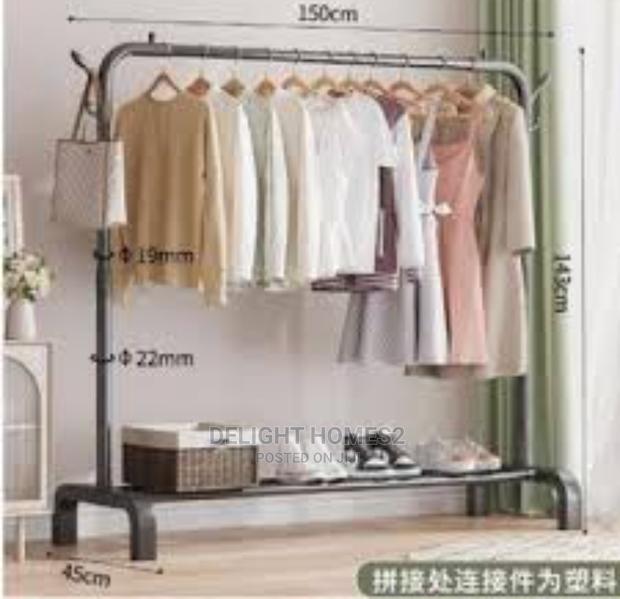 Metallic Clothing Rack With Lower Storage Shelf