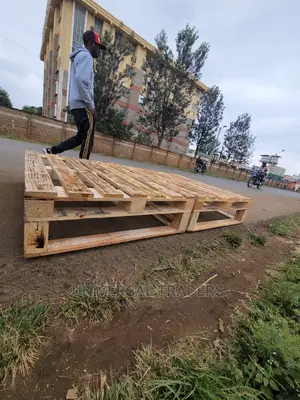 Torched Raised Wooden Pallet Bed