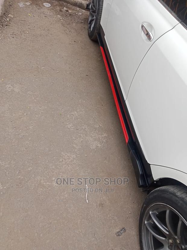 Saloon Car Fitted With Adjustable Side Skirts Black_red