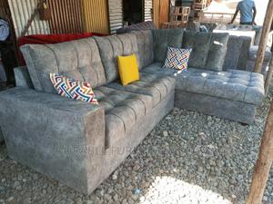 L Shaped Sofa a Table and 2 Throw Pillow - main view