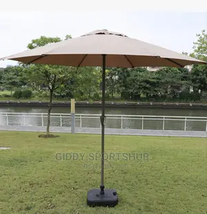 Folding an Outdoor Umbrella With an Iron Pipe