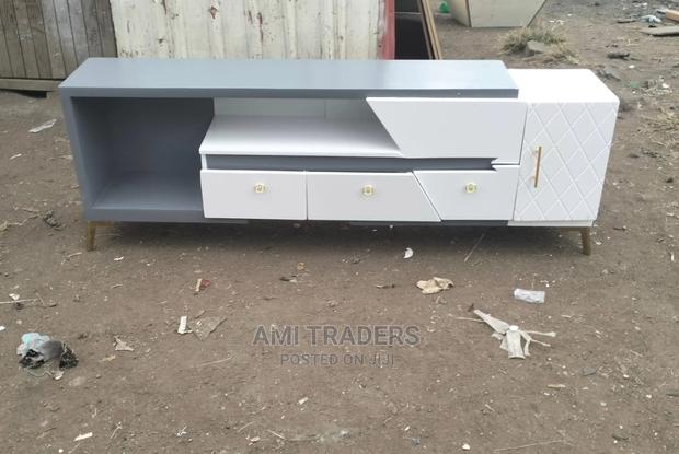 Gray-White Tv Stand With Golden Stands