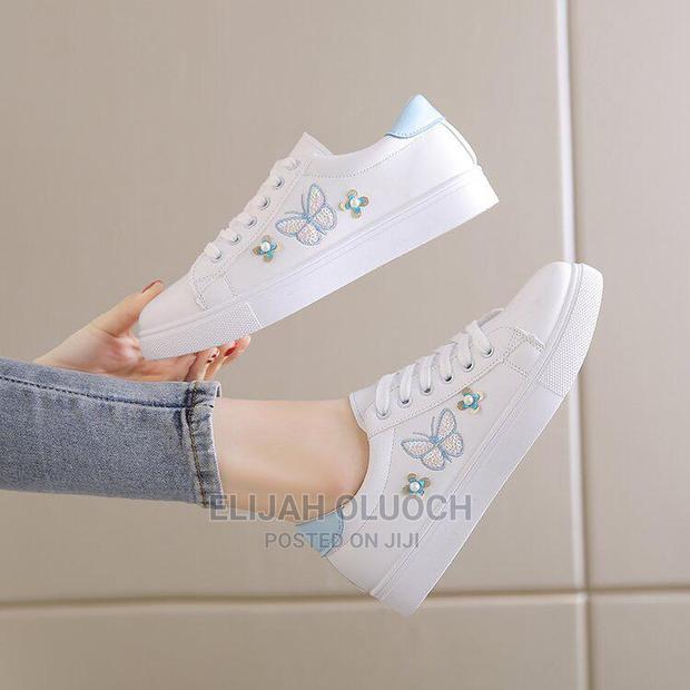 Lady's White Sneakers - main view